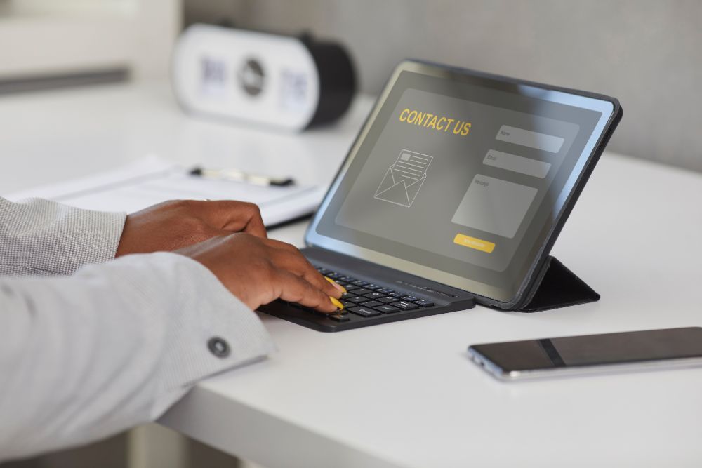 Visitor filling in a contact form on a tablet